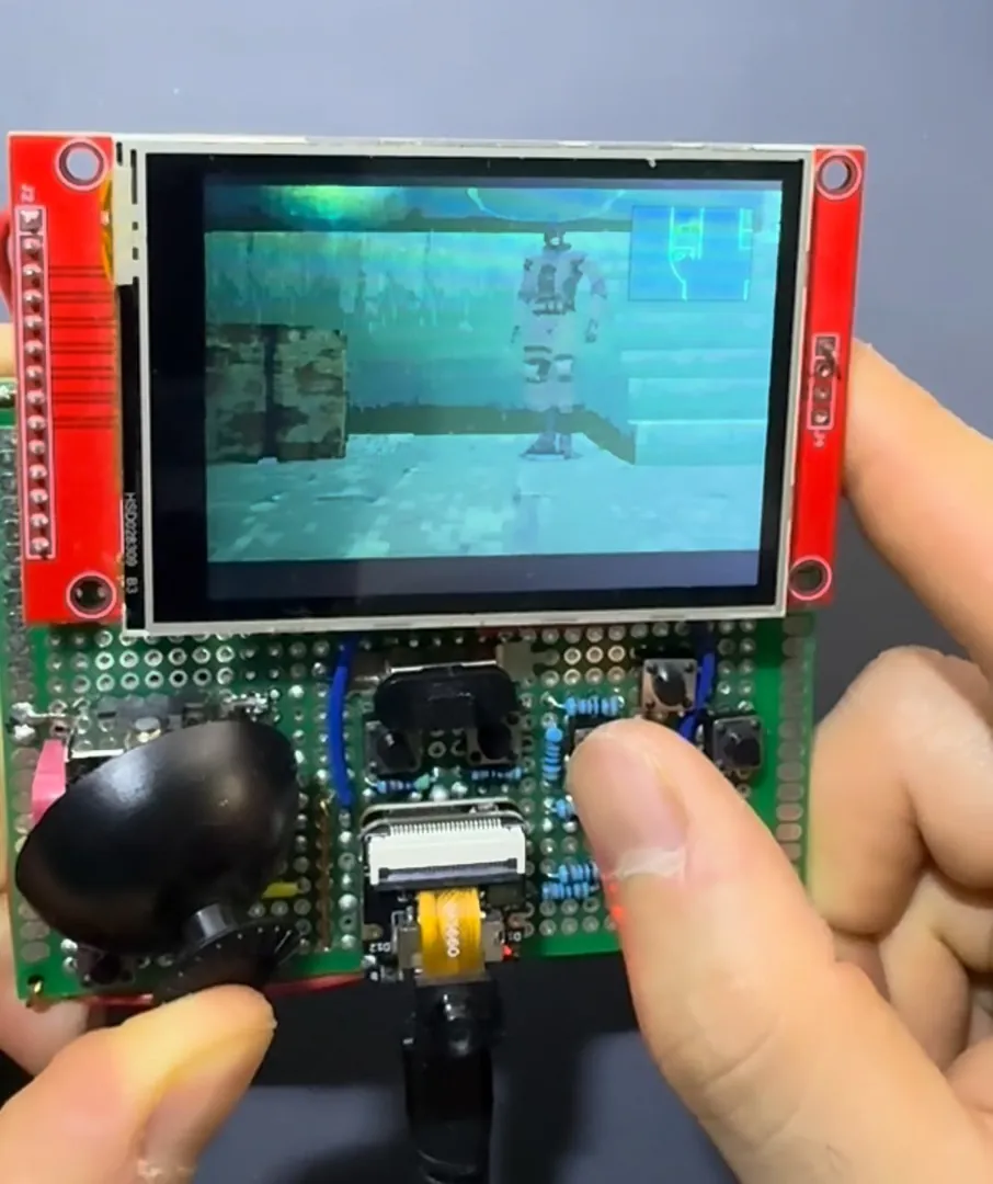 The XIAO ESP32S3 handheld running Metal Gear Solid at the dock, with the radar in the top-right corner