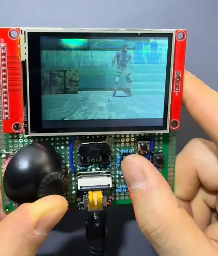 Playing Metal Gear Solid on the handheld at the dock