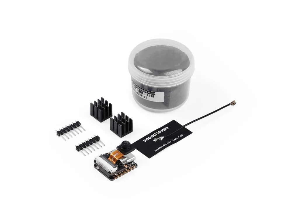 What comes in the XIAO ESP32S3 Sense box: the board with its camera, a Wi-Fi antenna, pin headers and heatsinks (photo: Seeed Studio)