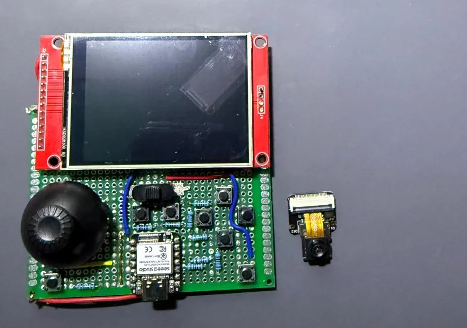 The front of the handheld next to the XIAO's camera module, which the port doesn't use and was taken off