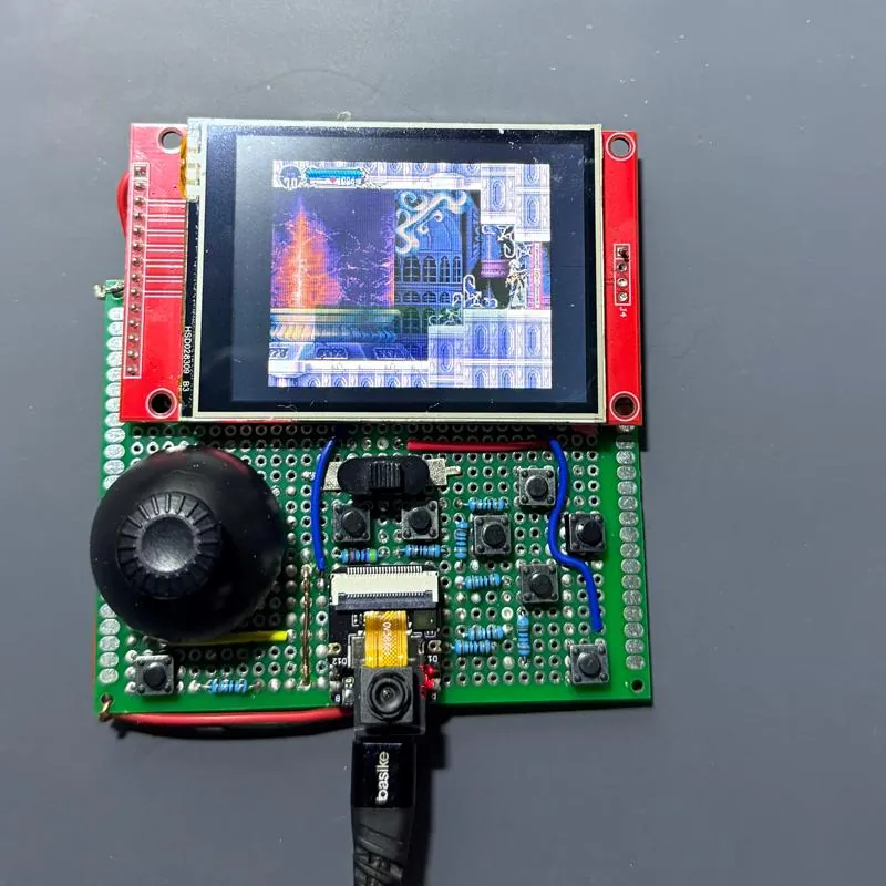 The finished handheld from above: ILI9341 panel, drone-gimbal stick, buttons and the XIAO on perfboard